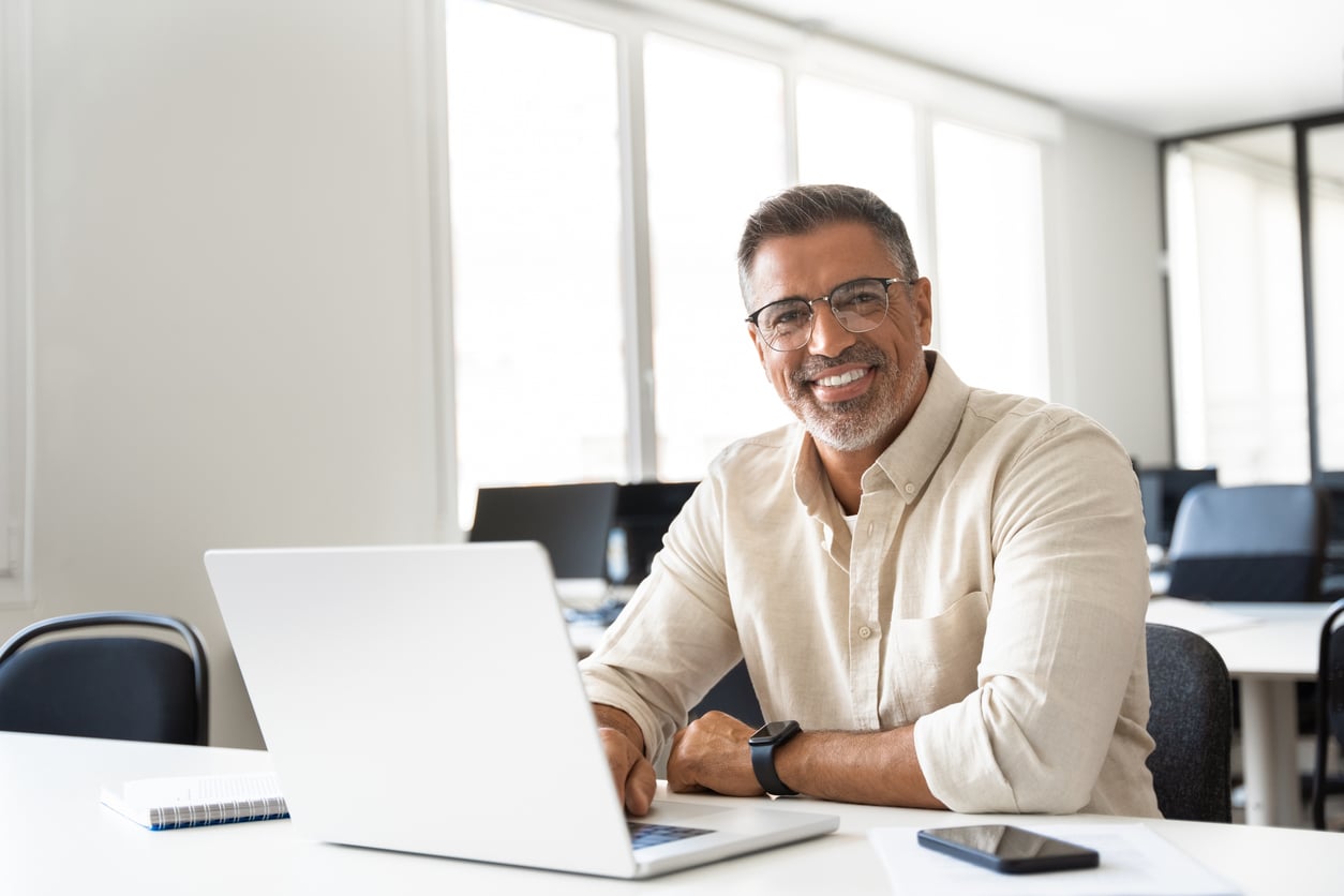 Mature gentlemen enjoying the benefits of the evolution of distance learning